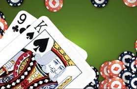Live dealer managing blackjack table with multiple camera angles visible